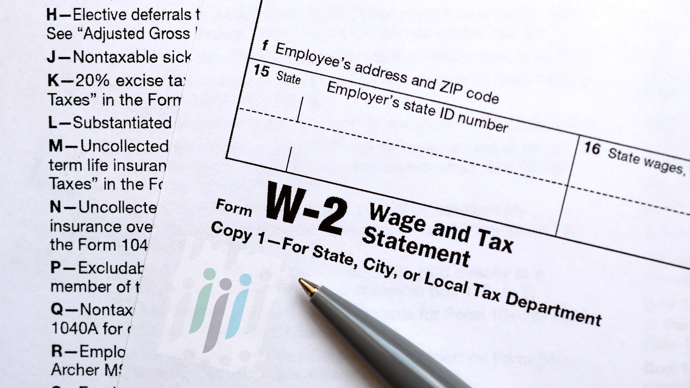 Image of a W-2 form and a pen sitting on top of it an Eastern Staffing & Recruiting watermark is in the lower left corner